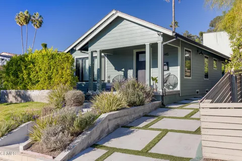 a kitchen with stainless steel appliances kitchen island granite countertop a refrigerator and a sink