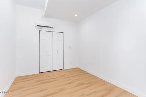 a view of a balcony with a tree