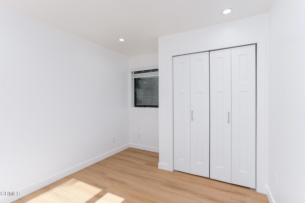 4947 Stratford Road Los Angeles, CA 90042 - Photo 20 of 30 an empty room with wooden floor and closet
