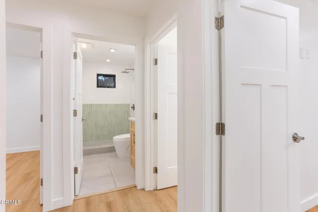 a bathroom with a glass door shower