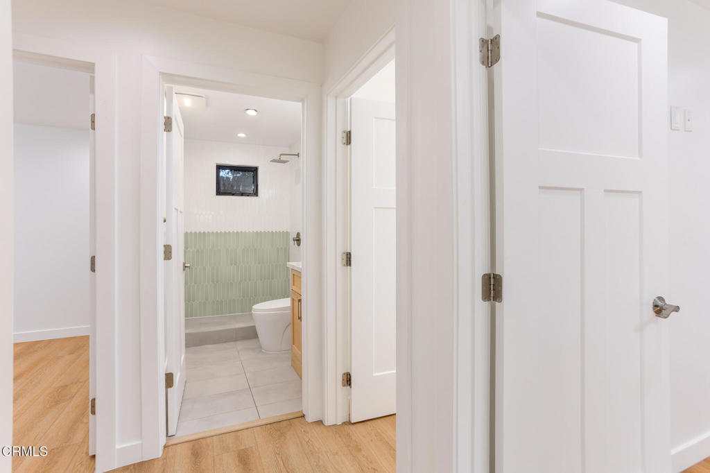 4947 Stratford Road Los Angeles, CA 90042 - Photo 22 of 30 a bathroom with a glass door shower