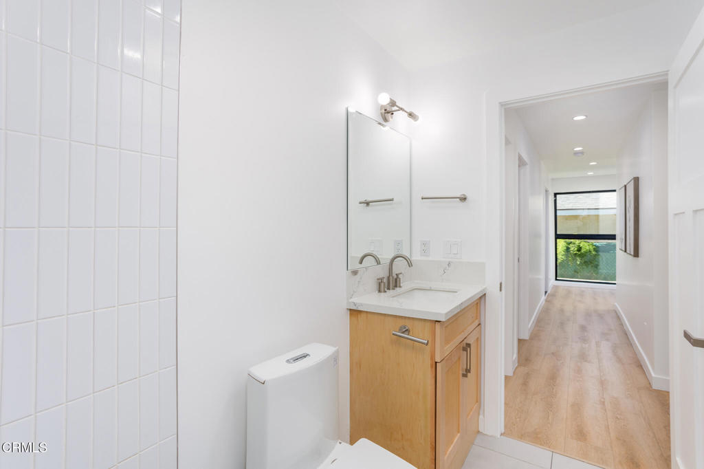 4947 Stratford Road Los Angeles, CA 90042 - Photo 24 of 30 a bathroom with a sink a toilet and shower