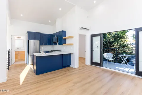 a view of a livingroom with furniture and wooden floor