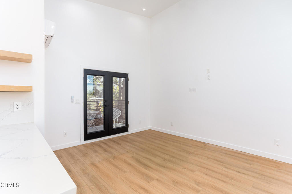 4947 Stratford Road Los Angeles, CA 90042 - Photo 7 of 30 a view of an empty room with wooden floor