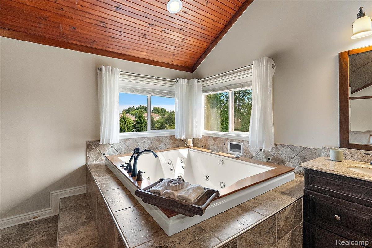62650 Mound Road Washington, MI 48094 - Photo 41 of 76 2-person jacuzzi with wood trim