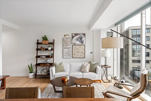a kitchen with stainless steel appliances granite countertop a white table and chairs