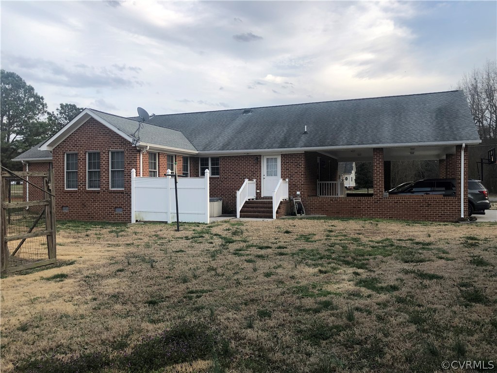 4797 Takach Road Prince George, VA 23875 - Photo 4 of 24 a front view of a house with a yard and garage