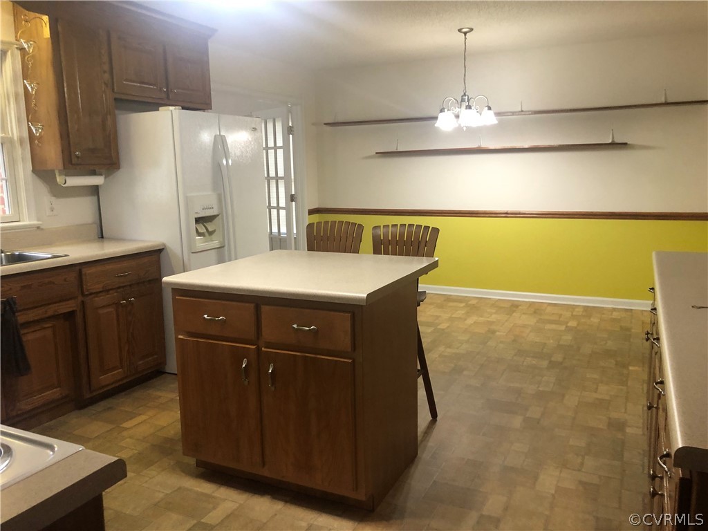 4797 Takach Road Prince George, VA 23875 - Photo 8 of 24 a kitchen with a sink a refrigerator and cabinets