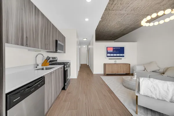 a dining room with furniture and wooden floor