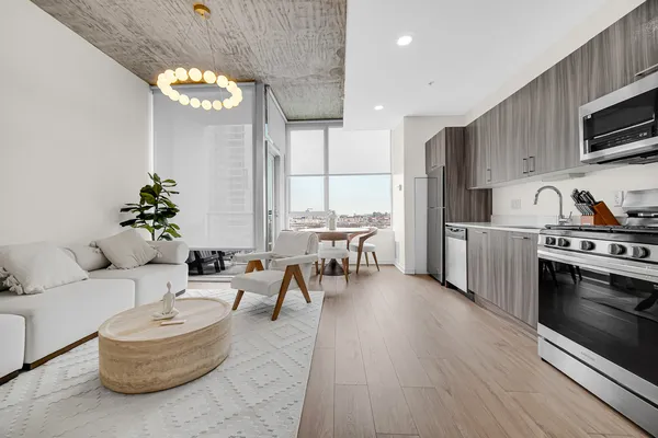 a large white bed in a white room