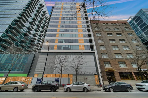 a view of cars parked in front of a building