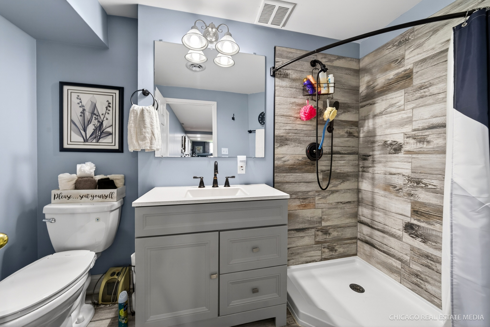 1513 Deerpass Road Marengo, IL 60152 - Photo 28 of 48 a bathroom with a sink toilet and shower