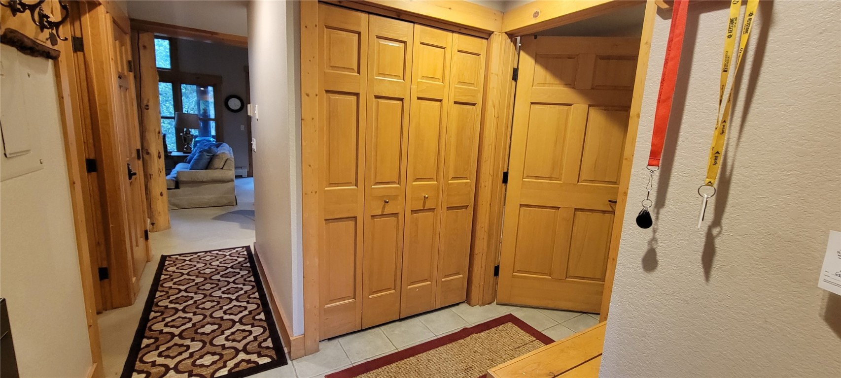 28 Trappers Crossing Trail, Unit 8760 Keystone, CO 80435 - Photo 28 of 37 a view of a hallway with wooden floor and staircase