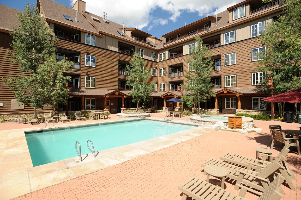 28 Trappers Crossing Trail, Unit 8760 Keystone, CO 80435 - Photo 30 of 37 a swimming pool with outdoor seating and yard