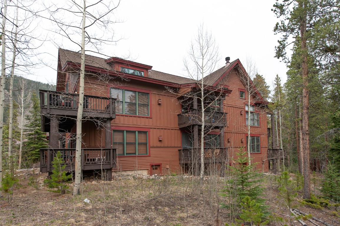 28 Trappers Crossing Trail, Unit 8760 Keystone, CO 80435 - Photo 3 of 37 front view of a house with a small yard
