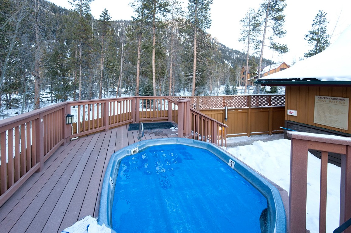 28 Trappers Crossing Trail, Unit 8760 Keystone, CO 80435 - Photo 31 of 37 a balcony with trees in front of it