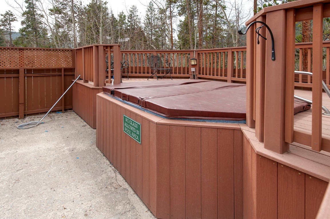28 Trappers Crossing Trail, Unit 8760 Keystone, CO 80435 - Photo 32 of 37 a backyard of a house with table and chairs