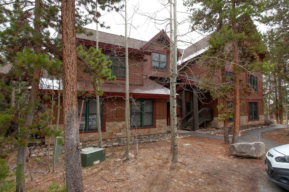 28 Trappers Crossing Trail, Unit 8760 Keystone, CO 80435 - Photo 6 of 37 a view of a house with a yard and garage
