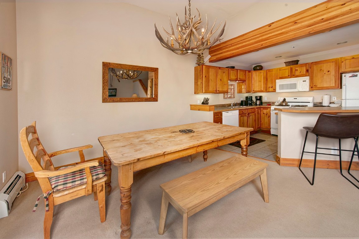 28 Trappers Crossing Trail, Unit 8760 Keystone, CO 80435 - Photo 10 of 37 a living room with stainless steel appliances granite countertop furniture and a kitchen view