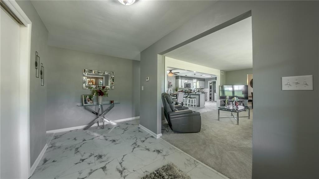 7 Indian Lane Vanderbilt, PA 15486 - Photo 19 of 38 a living room with furniture a dining table and chairs