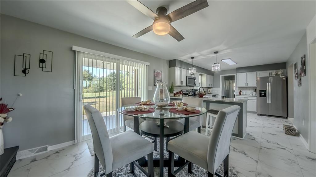 7 Indian Lane Vanderbilt, PA 15486 - Photo 23 of 38 a view of a dining room with furniture window and outside view