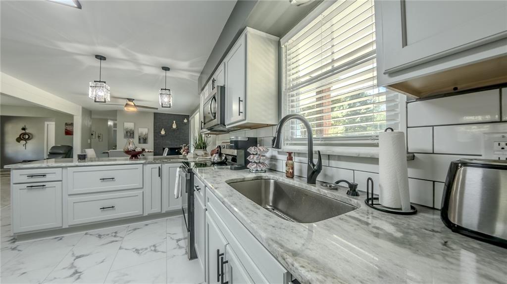 7 Indian Lane Vanderbilt, PA 15486 - Photo 25 of 38 a kitchen with sink cabinets and refrigerator