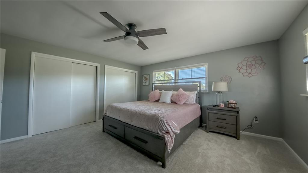 7 Indian Lane Vanderbilt, PA 15486 - Photo 29 of 38 a bedroom with a bed and a chandelier