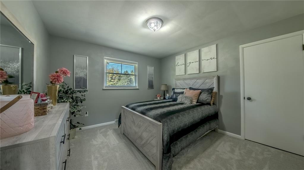 7 Indian Lane Vanderbilt, PA 15486 - Photo 30 of 38 a bed room with furniture and a potted plant