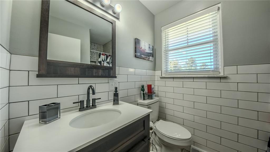 7 Indian Lane Vanderbilt, PA 15486 - Photo 37 of 38 a bathroom with a sink a toilet and mirror