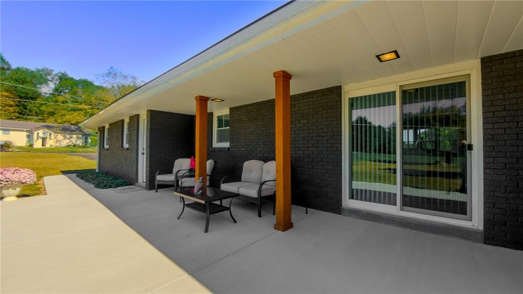 7 Indian Lane Vanderbilt, PA 15486 - Photo 6 of 38 a view of a house with backyard and porch