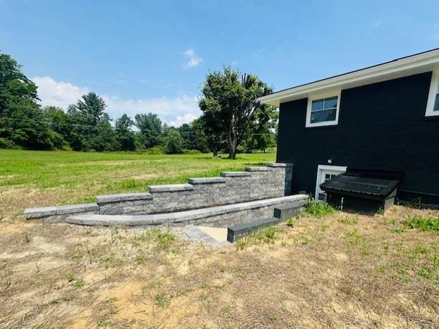 7 Indian Lane Vanderbilt, PA 15486 - Photo 7 of 38 a backyard of a house with a yard and outdoor seating