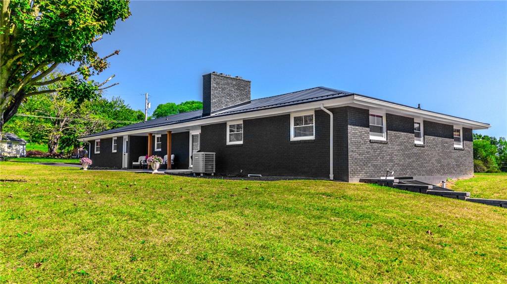 7 Indian Lane Vanderbilt, PA 15486 - Photo 10 of 38 a front view of a house with yard and green space