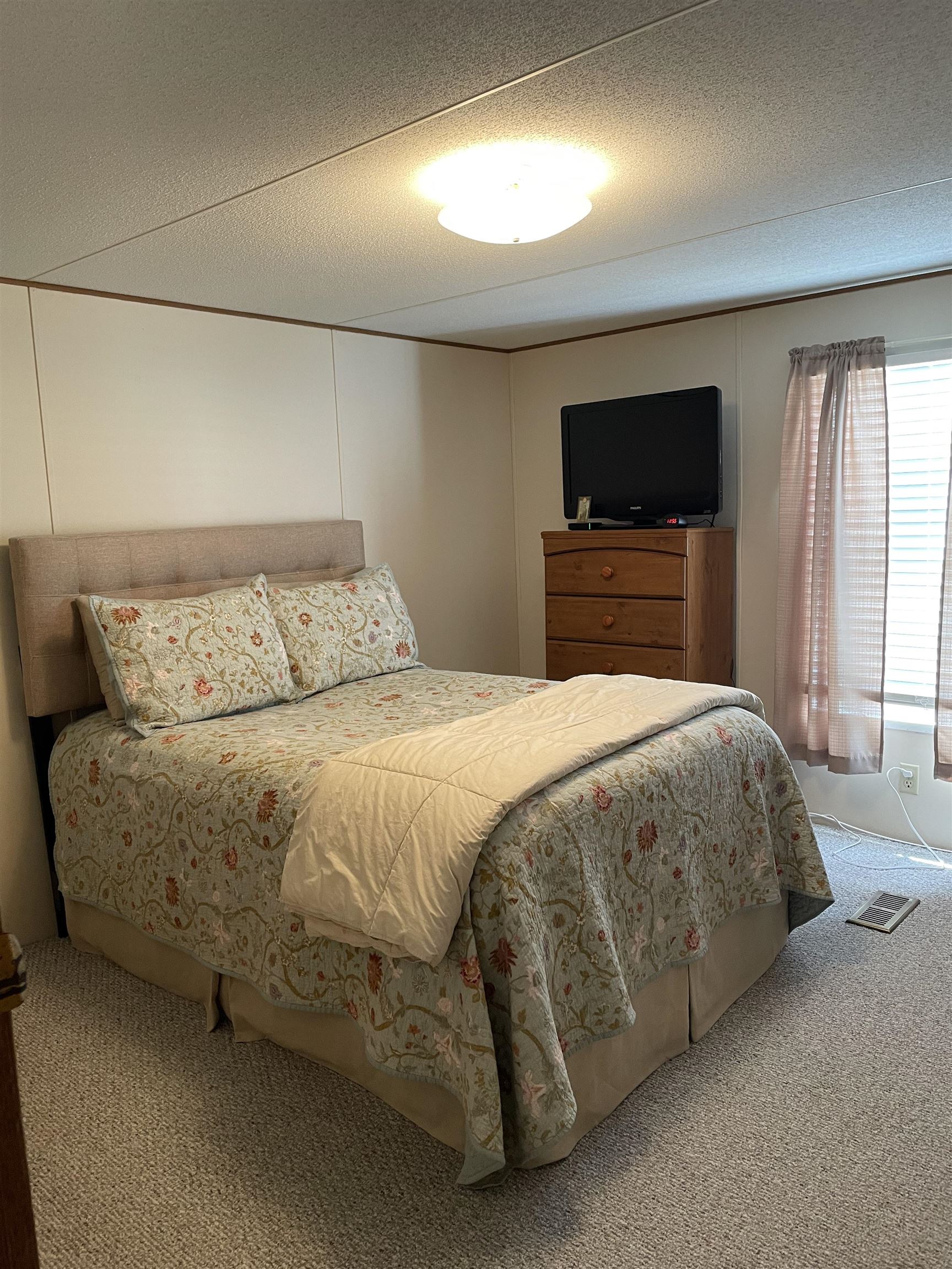 430 Highway 9 Marmora, NJ 08223 - Photo 4 of 17 a bedroom with a bed and a flat screen tv