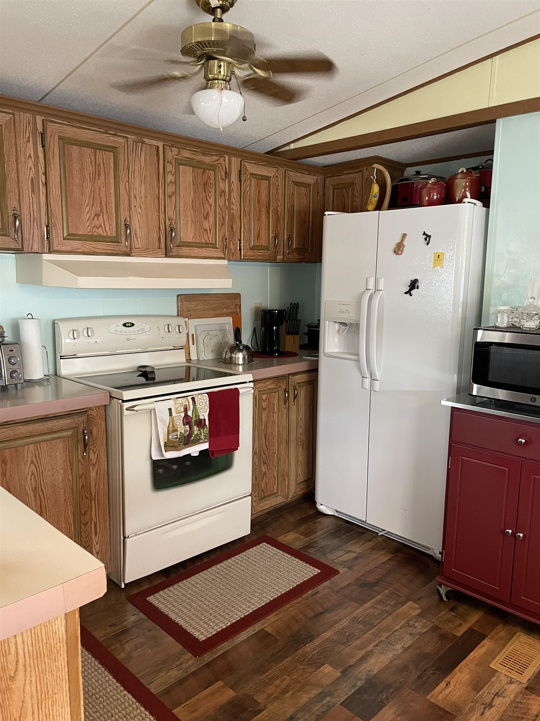 430 Highway 9 Marmora, NJ 08223 - Photo 6 of 17 a kitchen with stainless steel appliances granite countertop a refrigerator a stove and a sink with wooden floor
