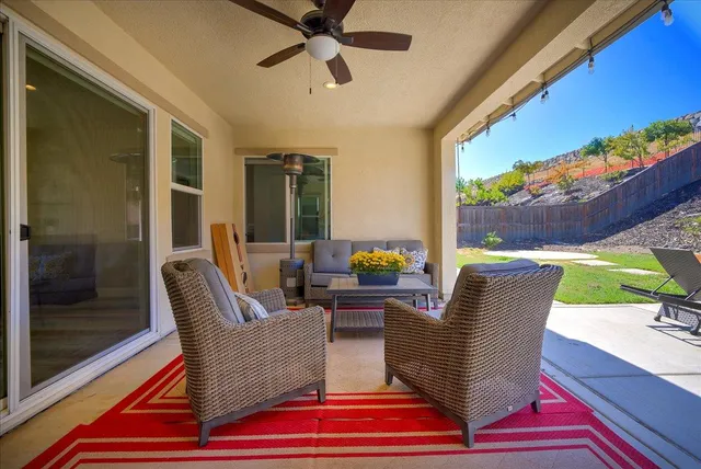 a outdoor living space with furniture and a potted plant