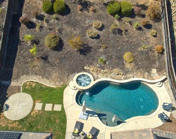 an aerial view of residential building and ocean view