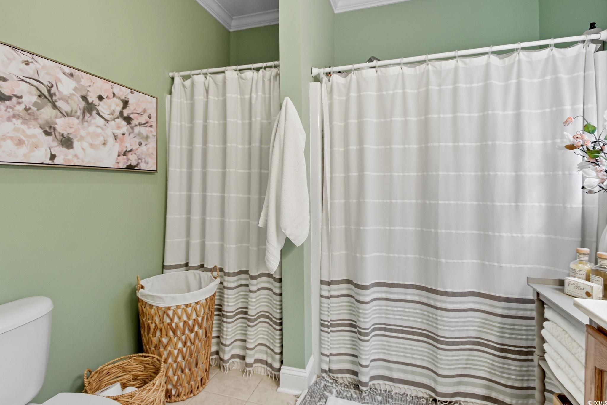 21 Craftsman Lane Georgetown, SC 29440 - Photo 23 of 39 Bathroom with crown molding, vanity, tile patterned floors, and a shower with shower curtain