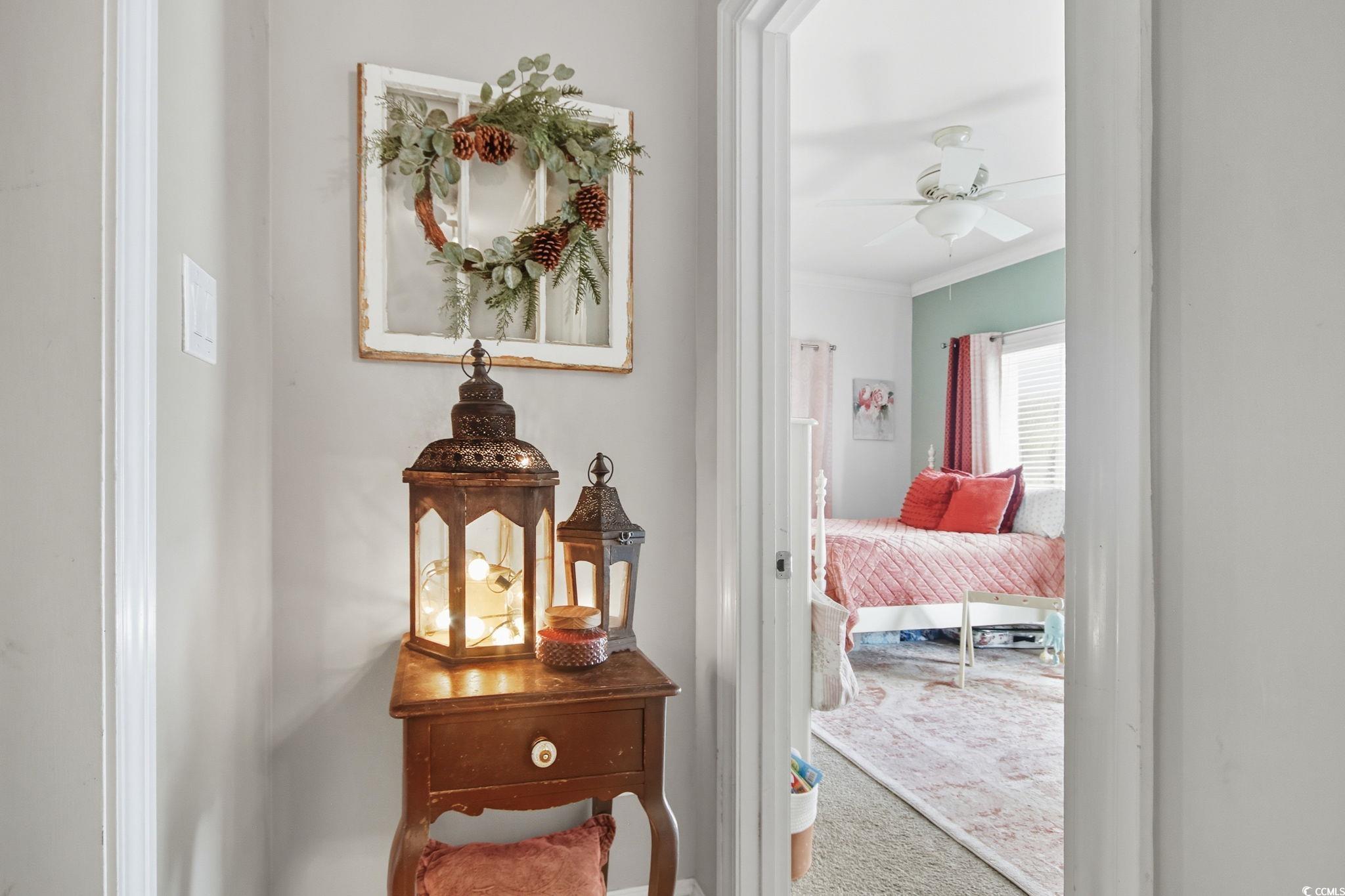 21 Craftsman Lane Georgetown, SC 29440 - Photo 25 of 39 Hallway with carpet floors and crown molding