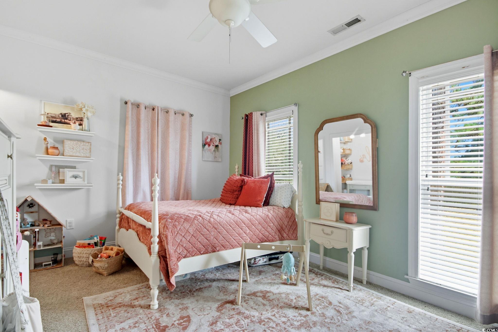 21 Craftsman Lane Georgetown, SC 29440 - Photo 28 of 39 Bedroom featuring ornamental molding, carpet, and a ceiling fan