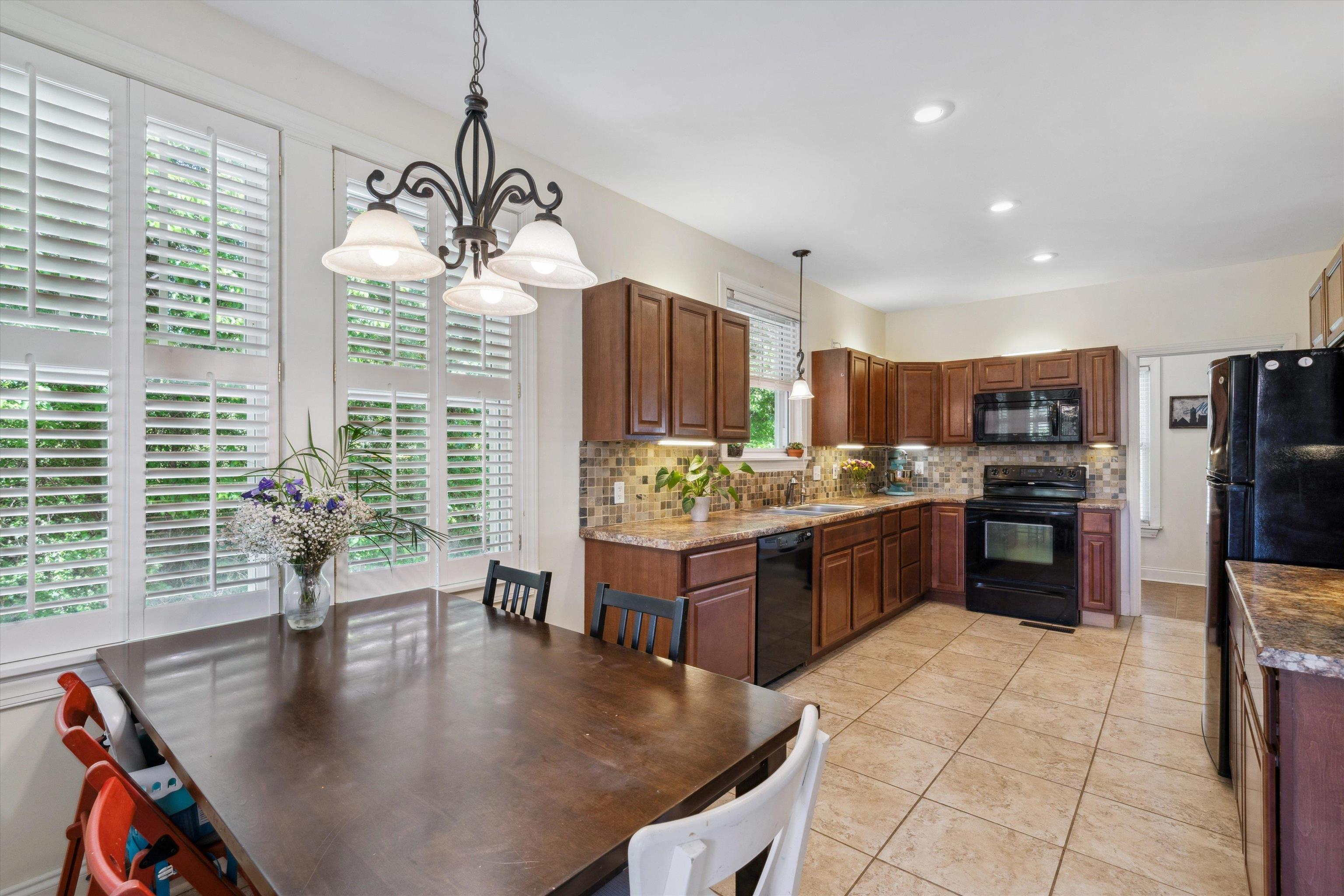 30 Blue Gray Road Piperton, TN 38017 - Photo 12 of 31 a large kitchen with kitchen island a large counter top stainless steel appliances and cabinets