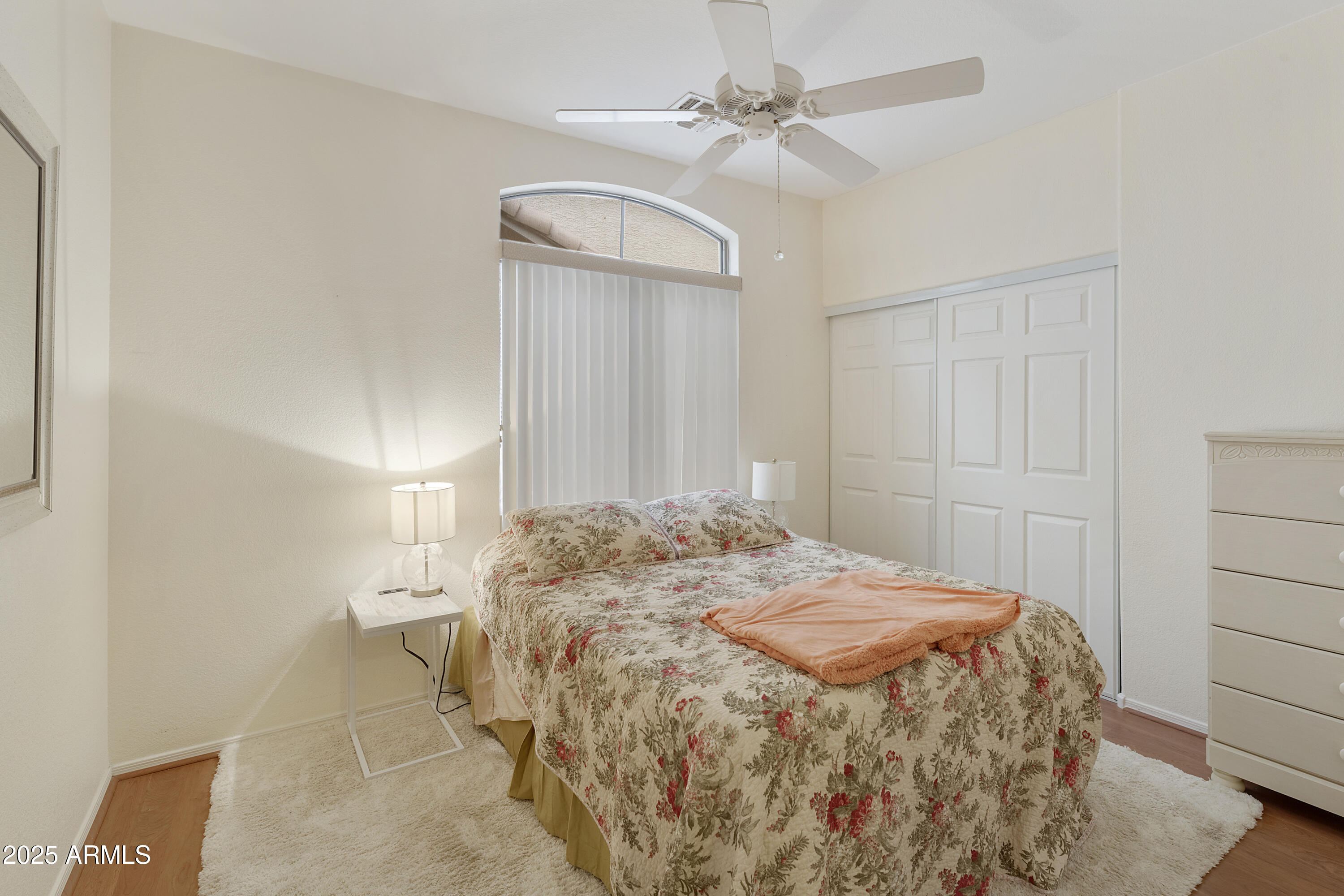 23745 South Vacation Way Sun Lakes, AZ 85248 - Photo 17 of 52 a bedroom with a bed and a chandelier
