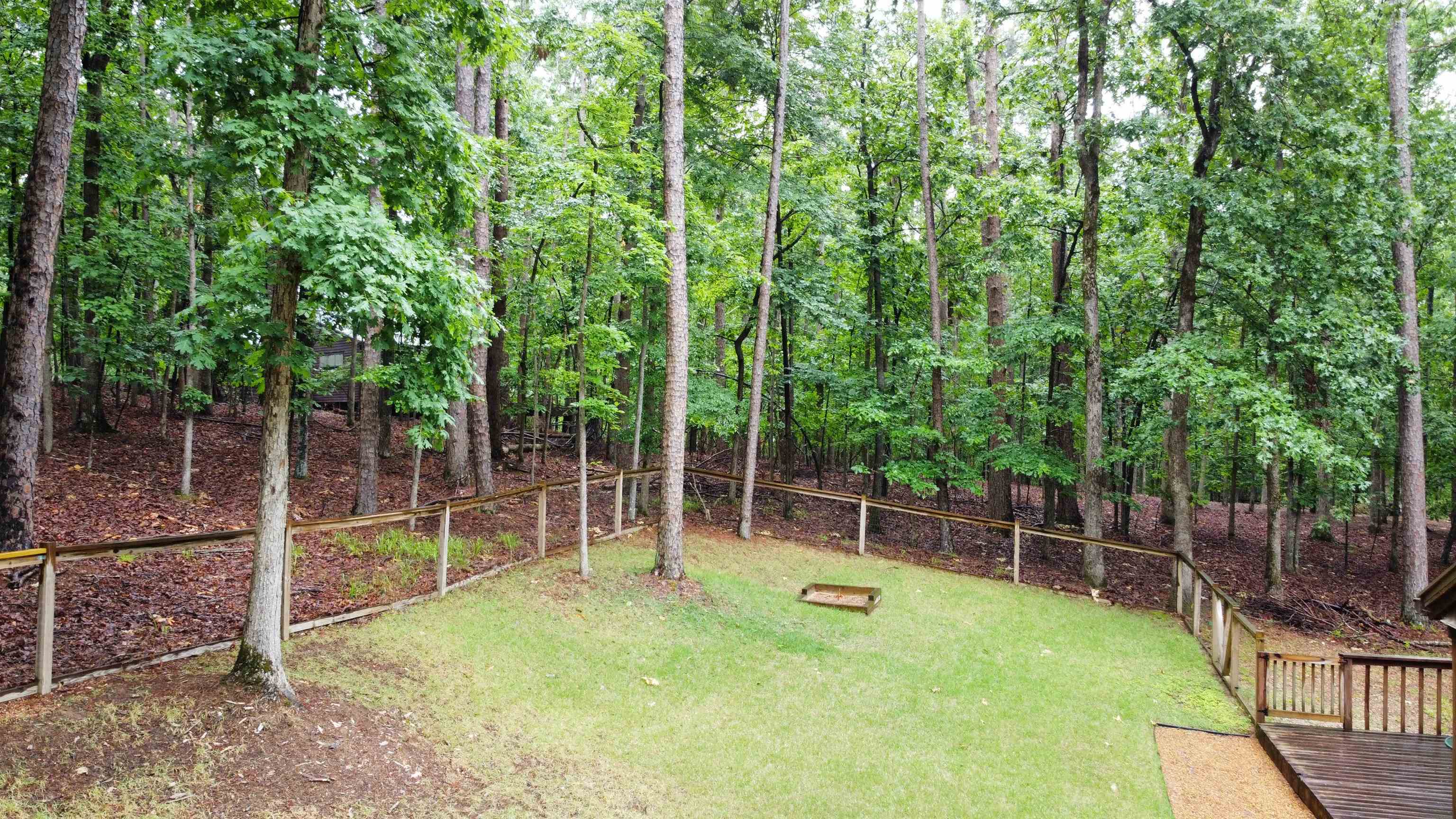 275 Bryson Harbor Road Counce, TN 38326 - Photo 6 of 23 Expansive backyard featuring a green lawn and mature trees