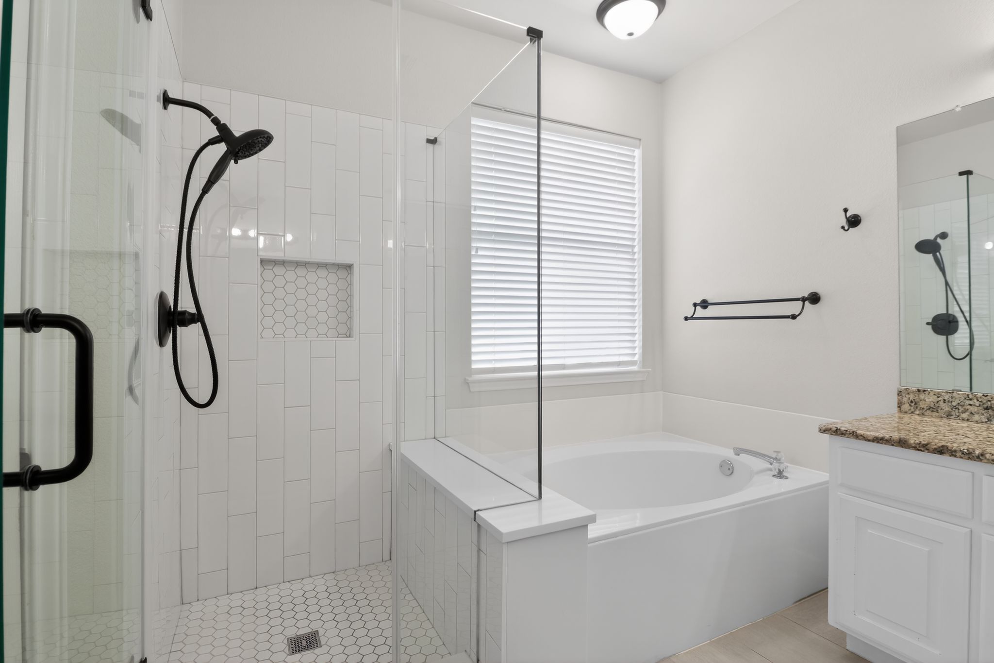 11918 Arbor Downs Road Austin, TX 78748 - Photo 21 of 29 Full bathroom with vanity, a shower stall, and a garden tub