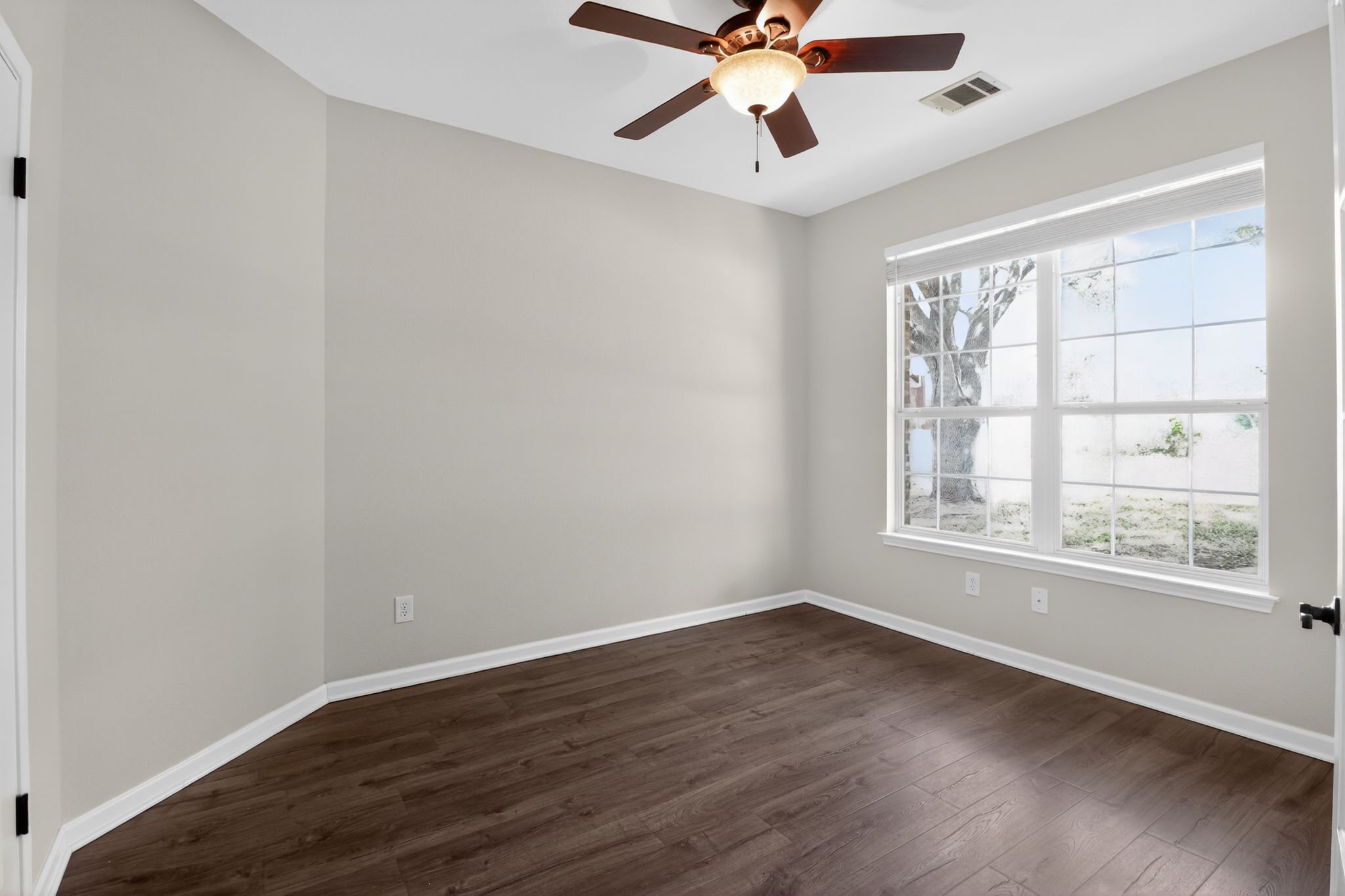 11918 Arbor Downs Road Austin, TX 78748 - Photo 5 of 29 Empty room with dark wood-type flooring and ceiling fan