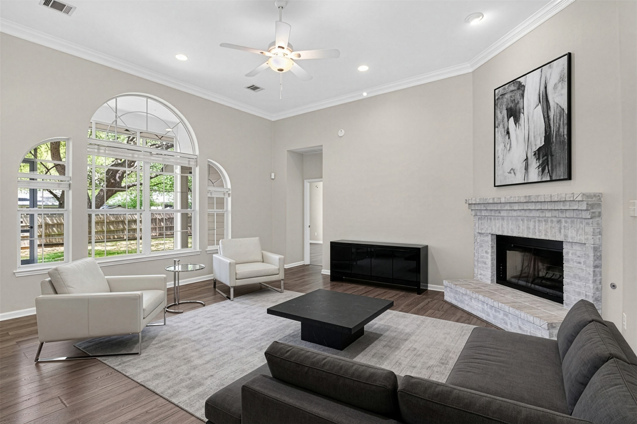 11918 Arbor Downs Road Austin, TX 78748 - Photo 6 of 29 (virtual staging)
Living area with wood finished floors, a ceiling fan, recessed lighting, a fireplace, and ornamental molding