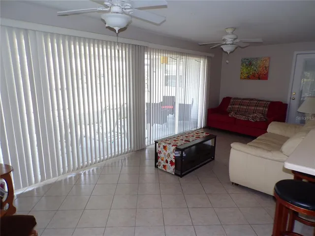 a car parked in a spacious bedroom next to a window