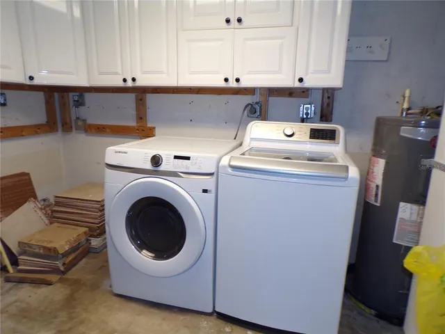 a utility room with dryer and washer