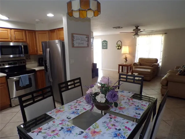 a living room with furniture fireplace and flat screen tv