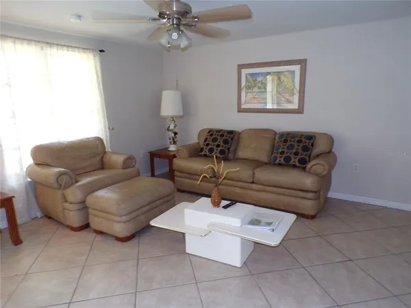 a living room with furniture and a window