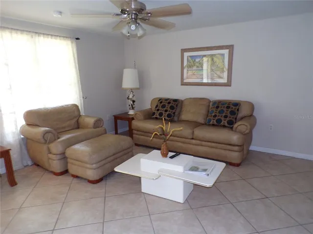 a living room with furniture and a window